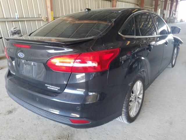 Photo 4 from auction – 2015 FORD FOCUS TITA with VIN 1FADP3J28FL259606