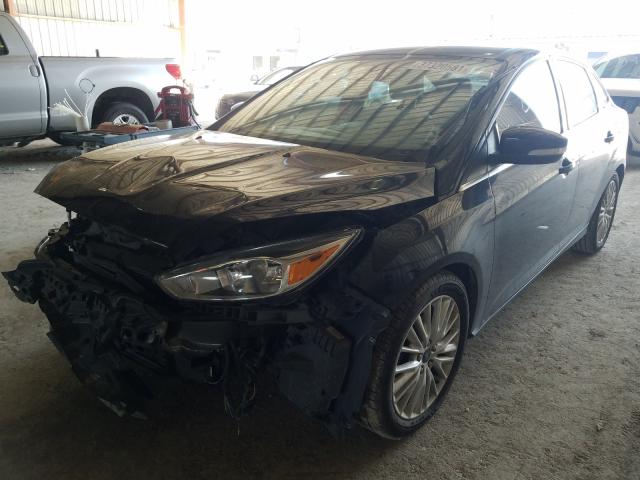 Photo 2 from auction – 2015 FORD FOCUS TITA with VIN 1FADP3J28FL259606