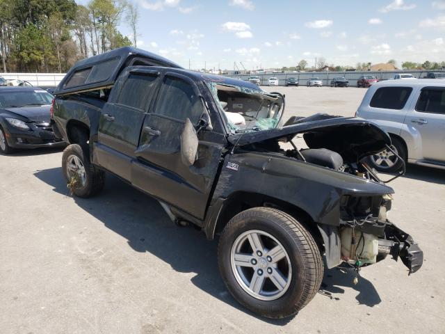 DODGE DAKOTA SLT 2011 with VIN 1D7RE3GP4BS536928 - Photo from auction