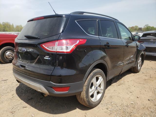 Photo 4 from auction – 2016 FORD ESCAPE SE with VIN 1FMCU9GX3GUC48749