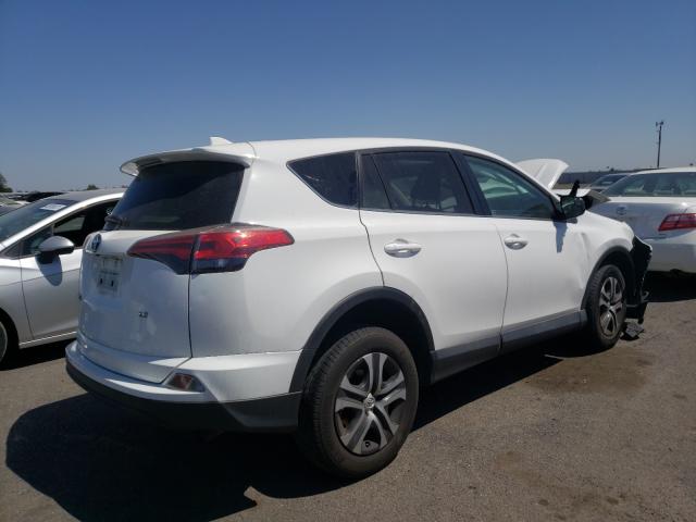 Photo 4 from auction – 2018 TOYOTA RAV4 LE with VIN 2T3ZFREV8JW507871