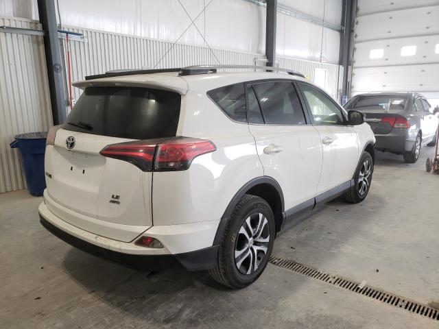 Photo 4 from auction – 2017 TOYOTA RAV4 LE with VIN JTMBFREV9HJ133698