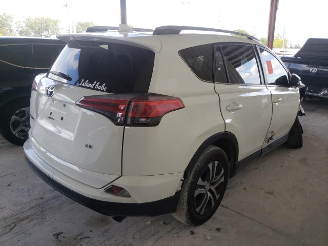 Photo 4 from auction – 2017 TOYOTA RAV4 LE with VIN JTMZFREV0HJ715834