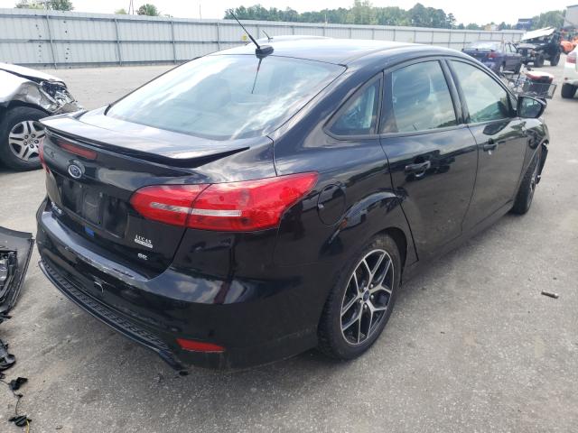 Photo 4 from auction – 2016 FORD FOCUS SE with VIN 1FADP3F21GL228319