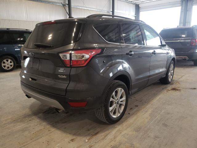 Photo 4 from auction – 2018 FORD ESCAPE SE with VIN 1FMCU9GD1JUA09763