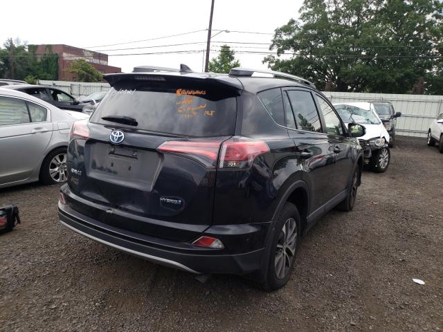 Photo 4 from auction – 2018 TOYOTA RAV4 HV LE with VIN JTMRJREV9JD226335