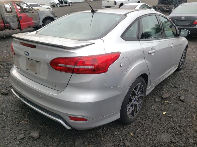 Photo 4 from auction – 2016 FORD FOCUS SE with VIN 1FADP3F23GL219170