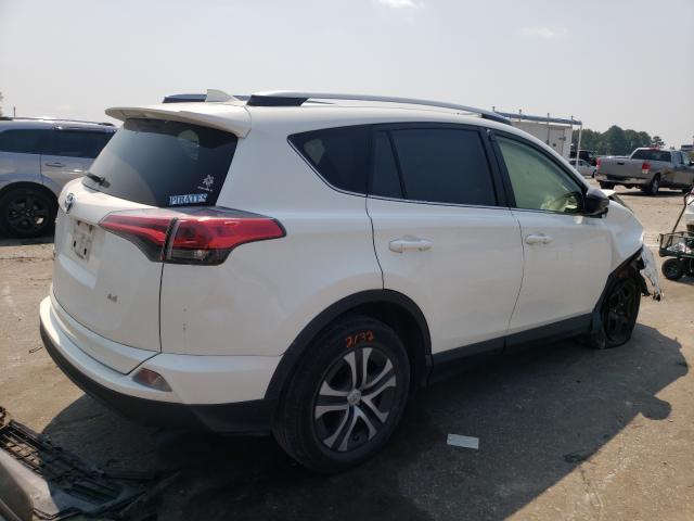 Photo 4 from auction – 2018 TOYOTA RAV4 LE with VIN JTMZFREV0JJ177402