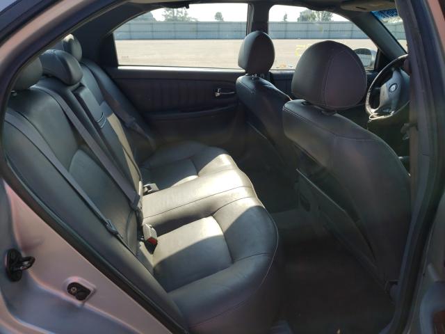 Photo 6 from auction – 2004 KIA OPTIMA LX with VIN KNAGD128945318457
