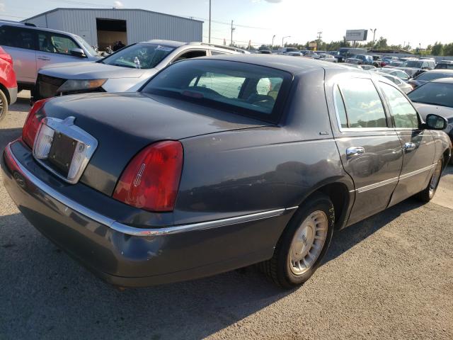 Photo 4 from auction – 1998 LINCOLN TOWN CAR E with VIN 1LNFM81W9WY667770