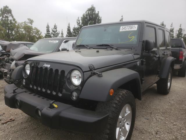 Photo 2 from auction – 2014 JEEP WRANGLER U with VIN 1C4BJWDGXEL116117