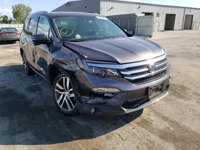 HONDA PILOT TOUR 2017 with VIN 5FNYF5H98HB020740 - Photo from auction