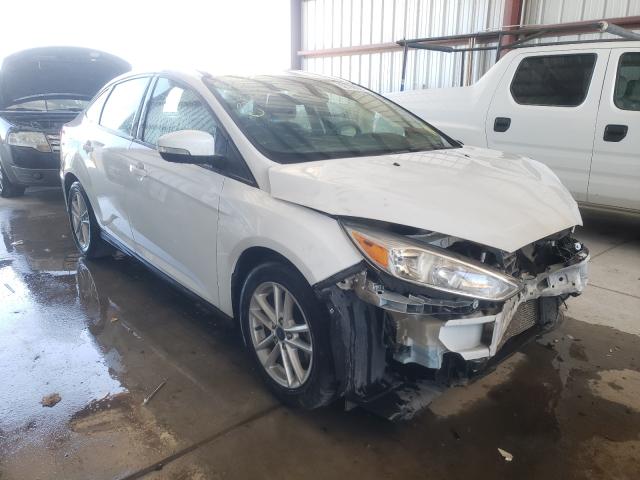 FORD FOCUS SE 2016 with VIN 1FADP3F21GL390628 - Photo from auction