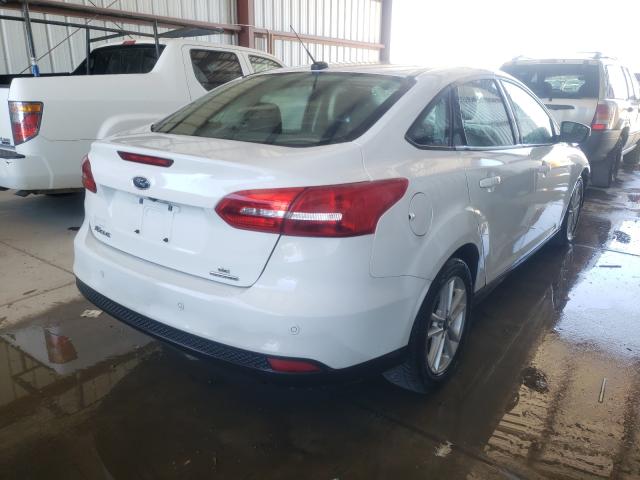 Photo 4 from auction – 2016 FORD FOCUS SE with VIN 1FADP3F21GL390628