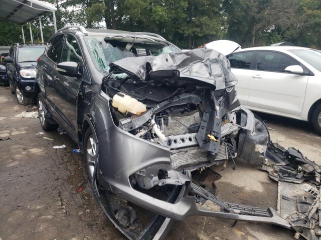 FORD ESCAPE TIT 2014 with VIN 1FMCU0J9XEUE37918 - Photo from auction