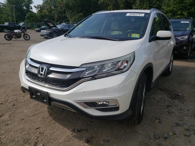 Photo 2 from auction – 2016 HONDA CR-V EXL with VIN 5J6RM4H7XGL000112