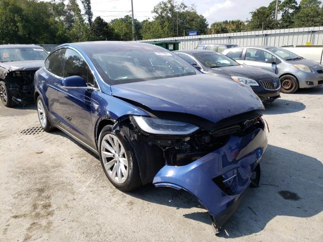 TESLA MODEL X 2018 with VIN 5YJXCDE25JF129555 - Photo from auction