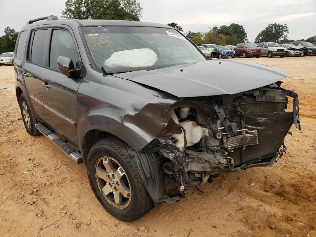 HONDA PILOT TOUR 2011 with VIN 5FNYF3H98BB018661 - Photo from auction