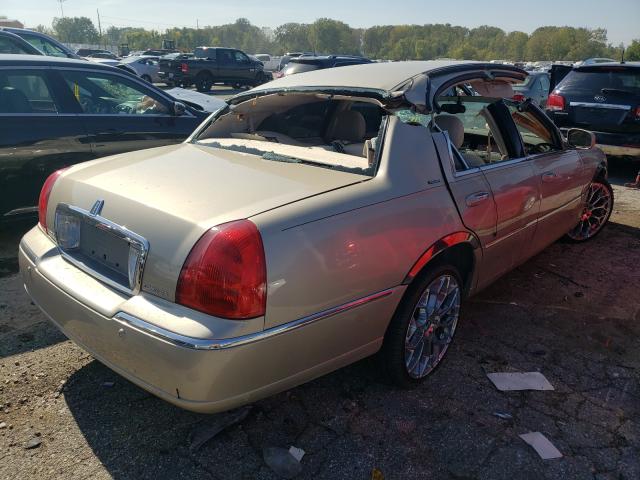 Photo 4 from auction – 2004 LINCOLN TOWN CAR E with VIN 1LNHM81W04Y612033