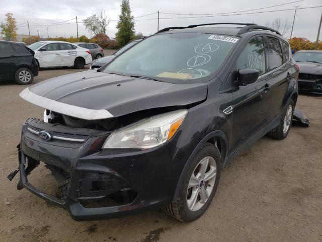 Photo 2 from auction – 2014 FORD ESCAPE SE with VIN 1FMCU9GX0EUD11772