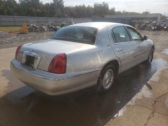 Photo 4 from auction – 1998 LINCOLN TOWN CAR E with VIN 1LNFM81W0WY693609
