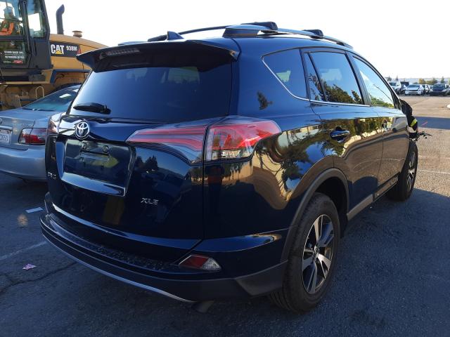 Photo 4 from auction – 2017 TOYOTA RAV4 XLE with VIN JTMWFREV0HD101030