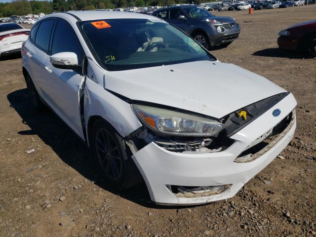 FORD FOCUS SE 2015 with VIN 1FADP3K21FL282126 - Photo from auction