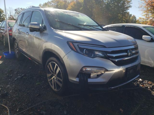 HONDA PILOT TOUR 2016 with VIN 5FNYF6H94GB113615 - Photo from auction
