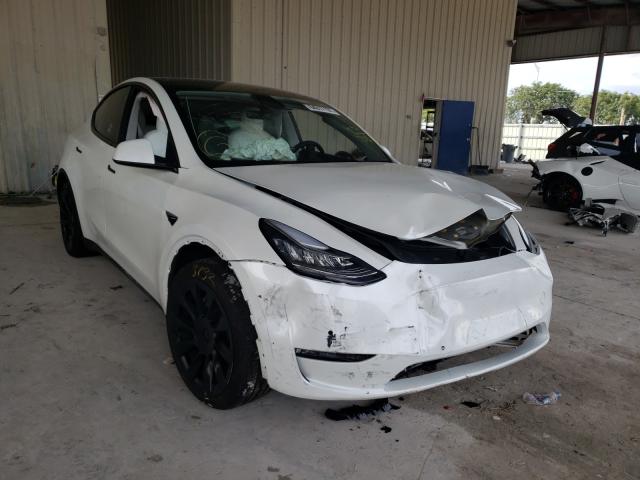 TESLA MODEL Y 2021 with VIN 5YJYGAEE0MF187644 - Photo from auction