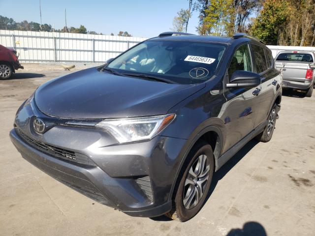 Photo 2 from auction – 2018 TOYOTA RAV4 LE with VIN 2T3ZFREV1JW461512