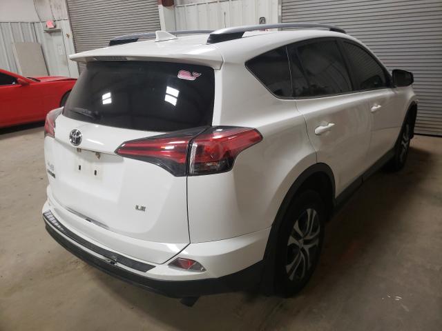 Photo 4 from auction – 2018 TOYOTA RAV4 LE with VIN JTMZFREV0JJ202931