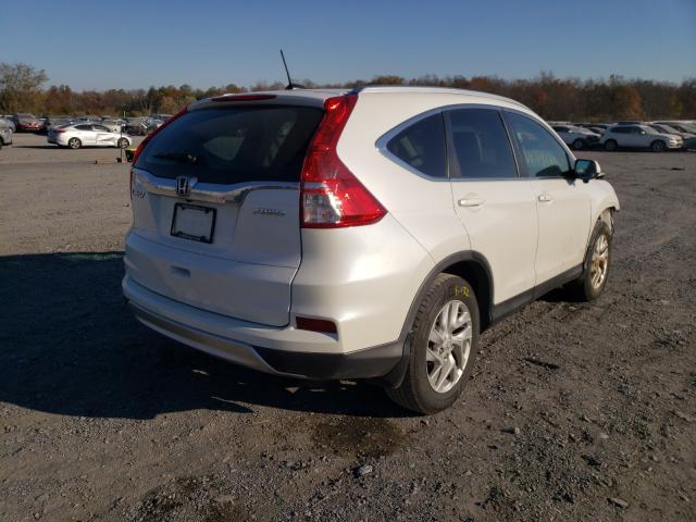Photo 4 from auction – 2015 HONDA CR-V EXL with VIN 5J6RM4H71FL054252