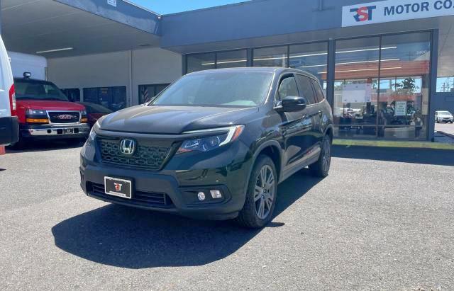 Photo 2 from auction – 2021 HONDA PASSPORT E with VIN 5FNYF8H50MB028338