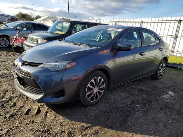 TOYOTA COROLLA L 2018 with VIN 5YFBURHE1JP748278 - Photo from auction