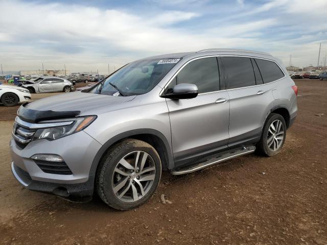 HONDA PILOT TOUR 2016 with VIN 5FNYF6H9XGB012207 - Photo from auction