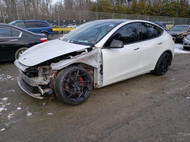 TESLA MODEL Y 2022 with VIN 7SAYGDEF8NF311173 - Photo from auction