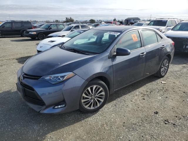 TOYOTA COROLLA L 2018 with VIN 5YFBURHE3JP761369 - Photo from auction