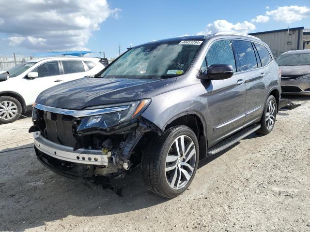 HONDA PILOT TOUR 2018 with VIN 5FNYF6H91JB020221 - Photo from auction