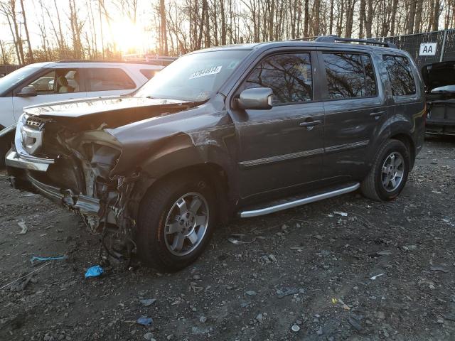 HONDA PILOT TOUR 2011 with VIN 5FNYF4H99BB029626 - Photo from auction