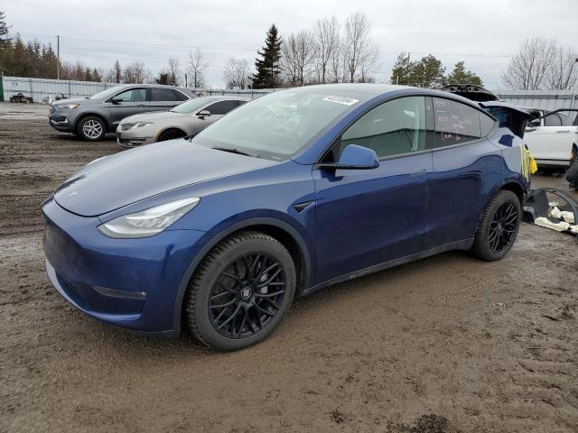 TESLA MODEL Y 2022 with VIN 7SAYGDEE3NF574310 - Photo from auction