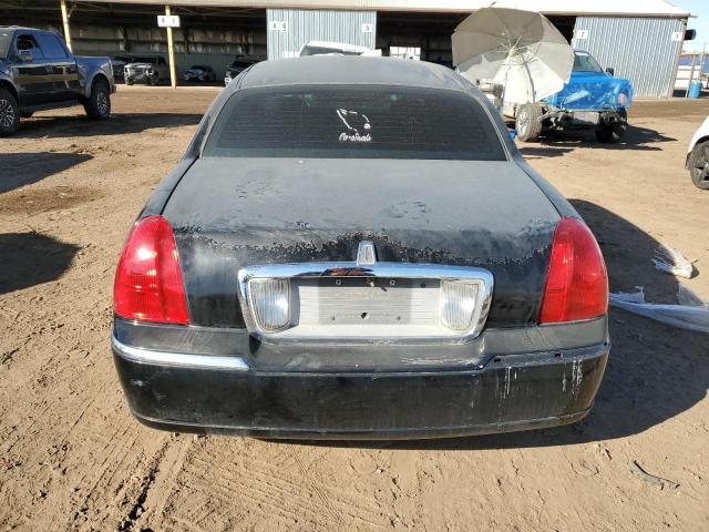 Photo 6 from auction – 2004 LINCOLN TOWN CAR E with VIN 1LNHM81W64Y659034