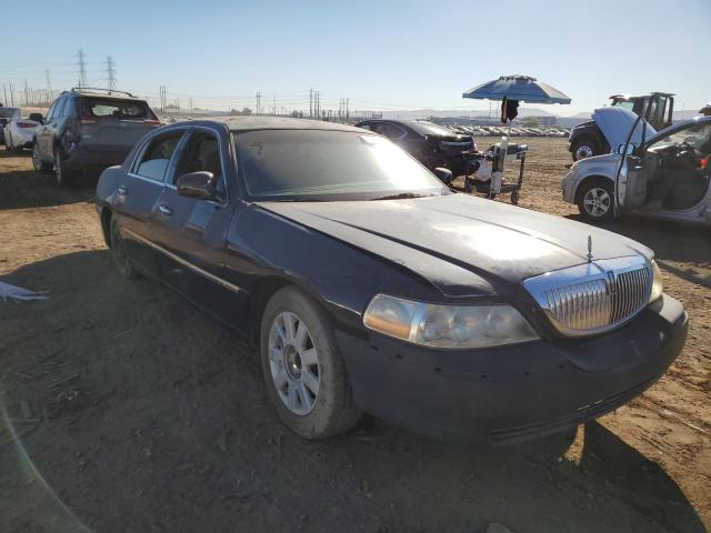 Photo 4 from auction – 2004 LINCOLN TOWN CAR E with VIN 1LNHM81W64Y659034