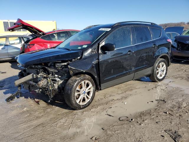 FORD ESCAPE SE 2018 with VIN 1FMCU0GD9JUC46058 - Photo from auction