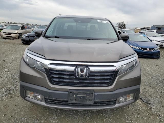 Photo 5 from auction – 2020 HONDA RIDGELINE with VIN 5FPYK3F74LB007100