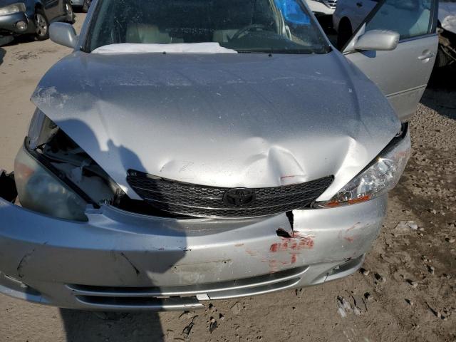 Photo 11 from auction – 2004 TOYOTA CAMRY LE with VIN 4T1BE30K34U921409