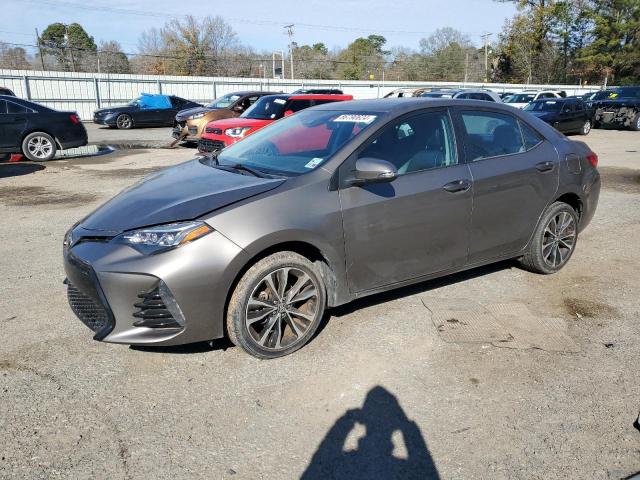 TOYOTA COROLLA L 2019 with VIN 5YFBURHE1KP877980 - Photo from auction
