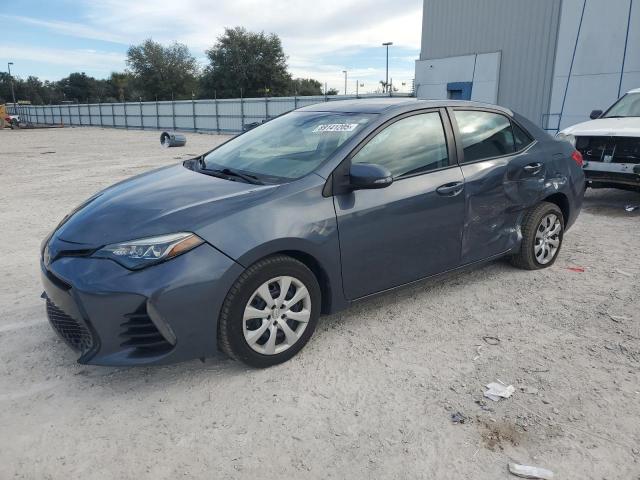 TOYOTA COROLLA L 2018 with VIN 5YFBURHE7JP802795 - Photo from auction