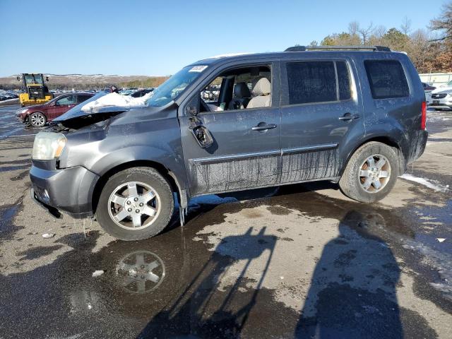HONDA PILOT TOUR 2010 with VIN 5FNYF4H94AB022954 - Photo from auction