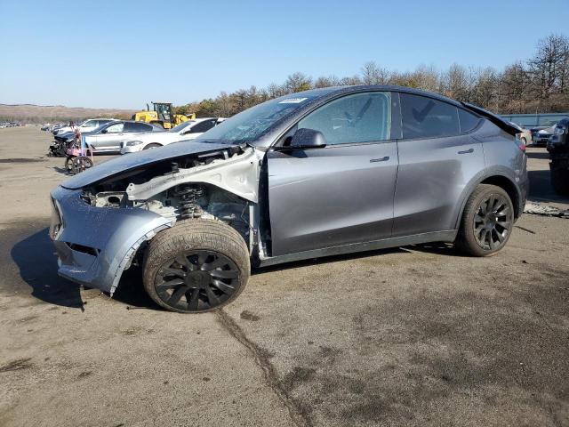 TESLA MODEL Y 2023 with VIN 7SAYGDED6PF933983 - Photo from auction