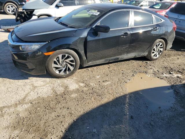 HONDA CIVIC EX 2018 with VIN 19XFC2F74JE003168 - Photo from auction